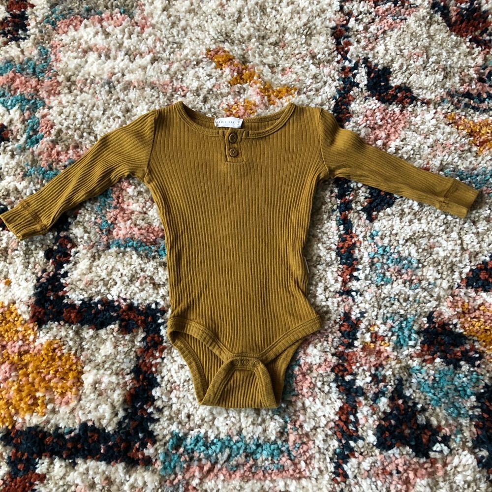 Jamie Kay golden bodysuit